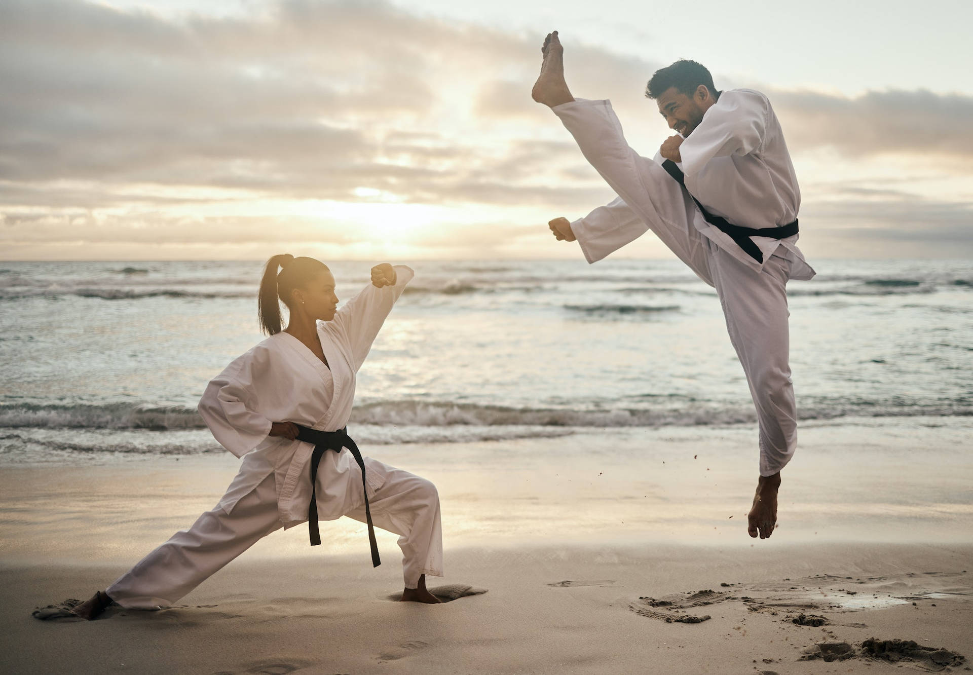Karate Fight At Beach During Sunset Wallpaper