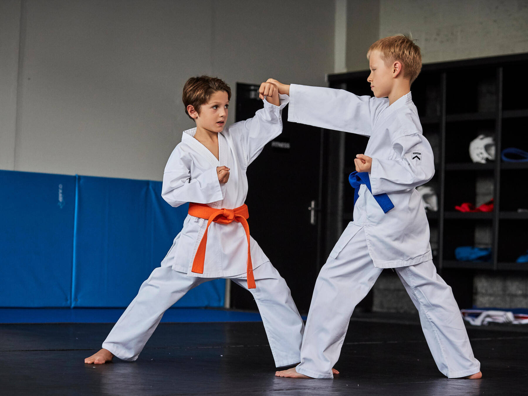 Two Young Karate Students Showcasing Their Skills Wallpaper