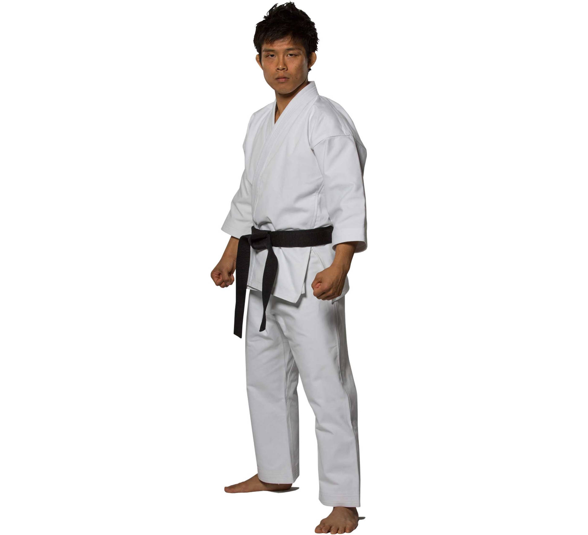 Hombrede Karate En Uniforme De Karate Sobre Fondo Blanco. Fondo de pantalla