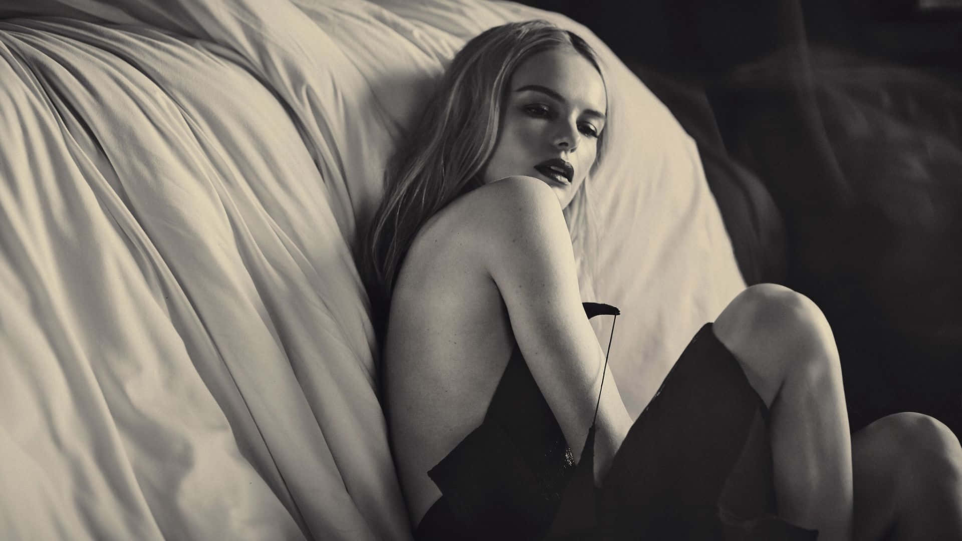 Kate Bosworth striking a pose in an elegant dress Wallpaper