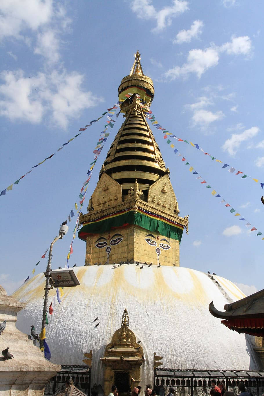 Caption: Majestic view of the white and yellow Stupa in Kathmandu. Wallpaper