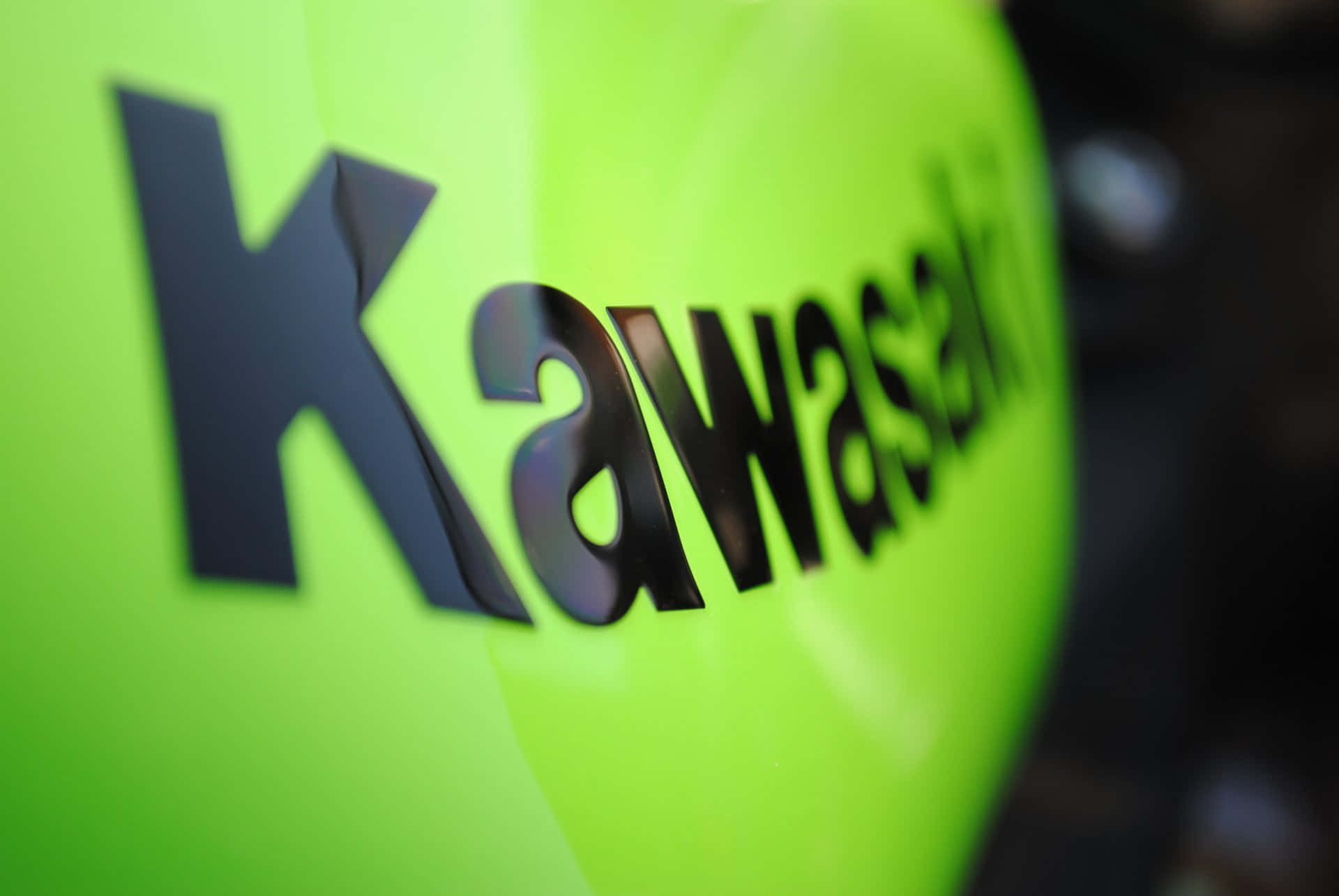 Kawasaki Logo On A Green Motorcycle Wallpaper