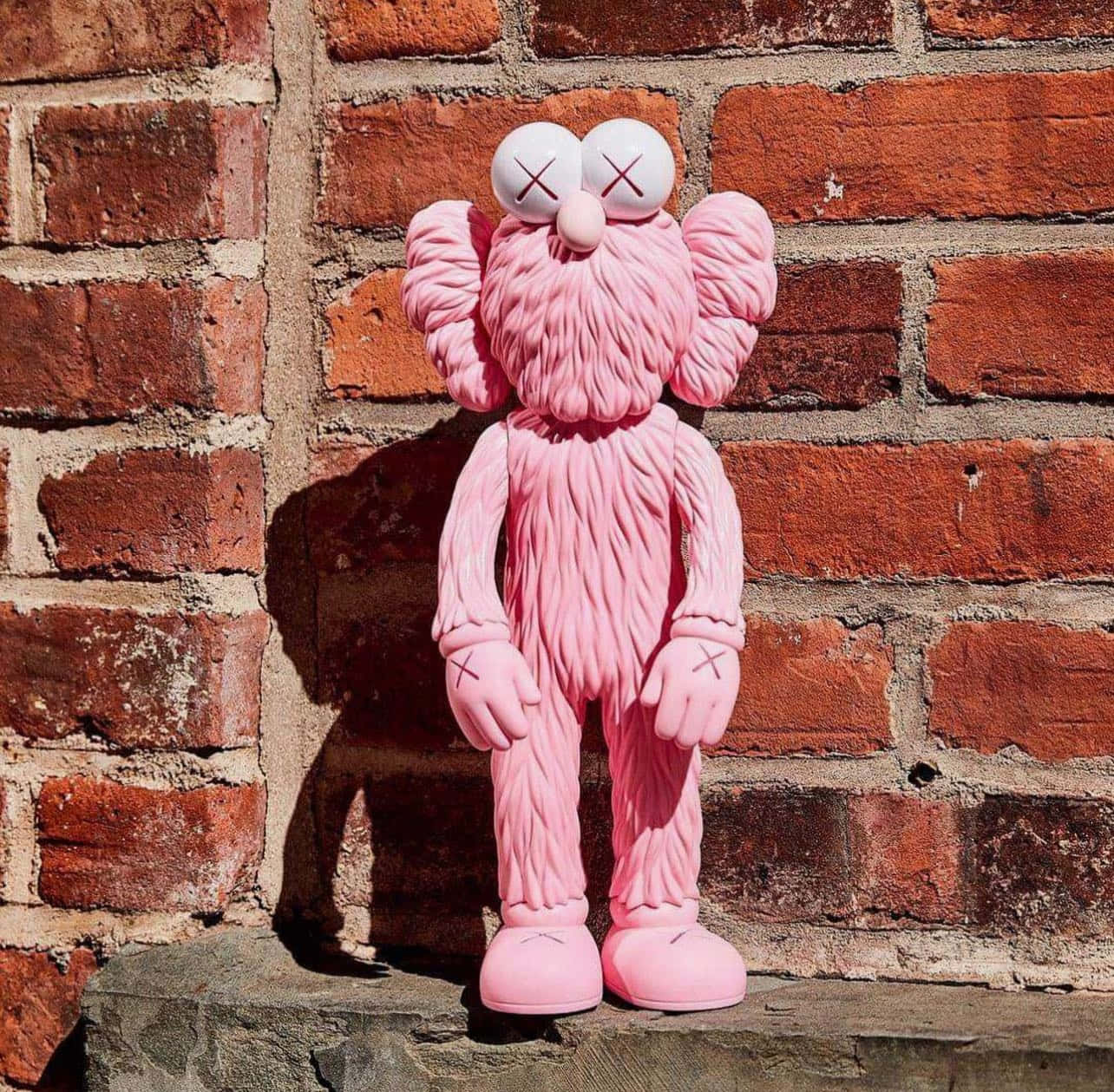 Kaws B F F Roze Figuur Bakstenen Achtergrond Achtergrond