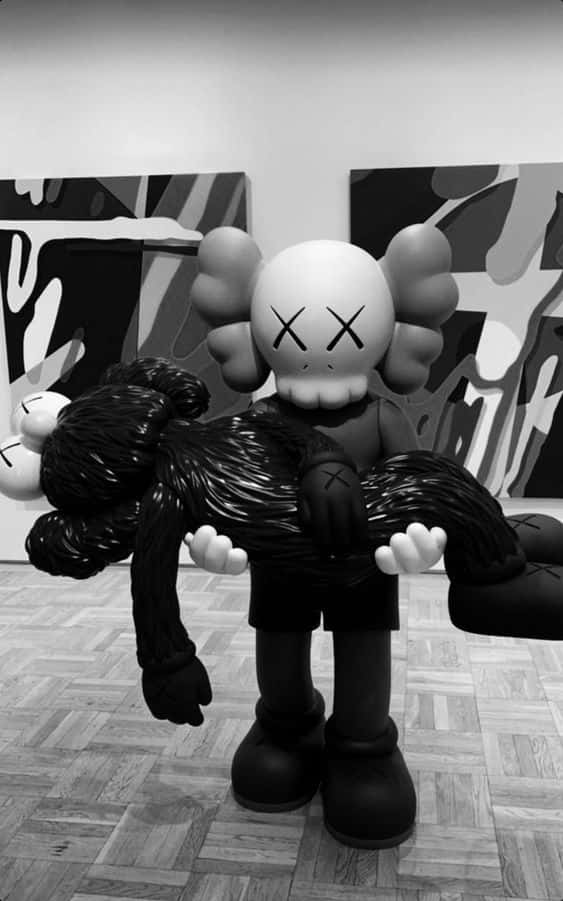 Kaws Carrying Dead Body Black And White Wallpaper