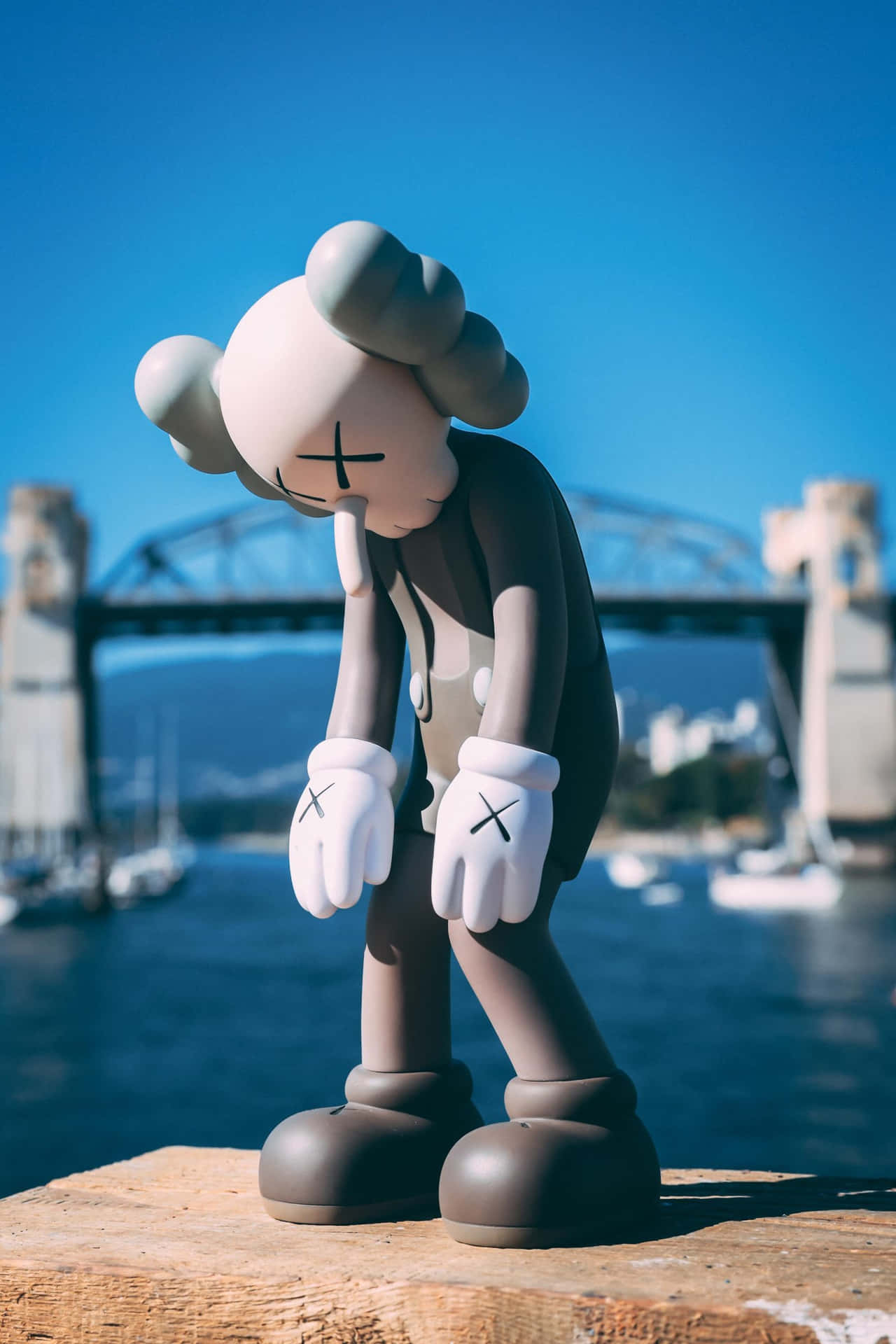 Kaws Figure Harbor Backdrop Wallpaper