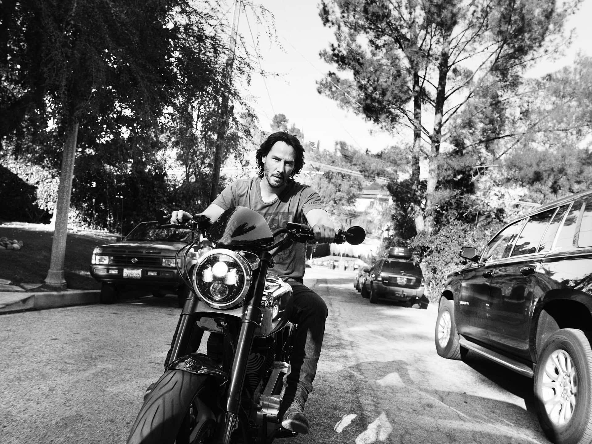 Keanu Reeves striking a pose during a photoshoot