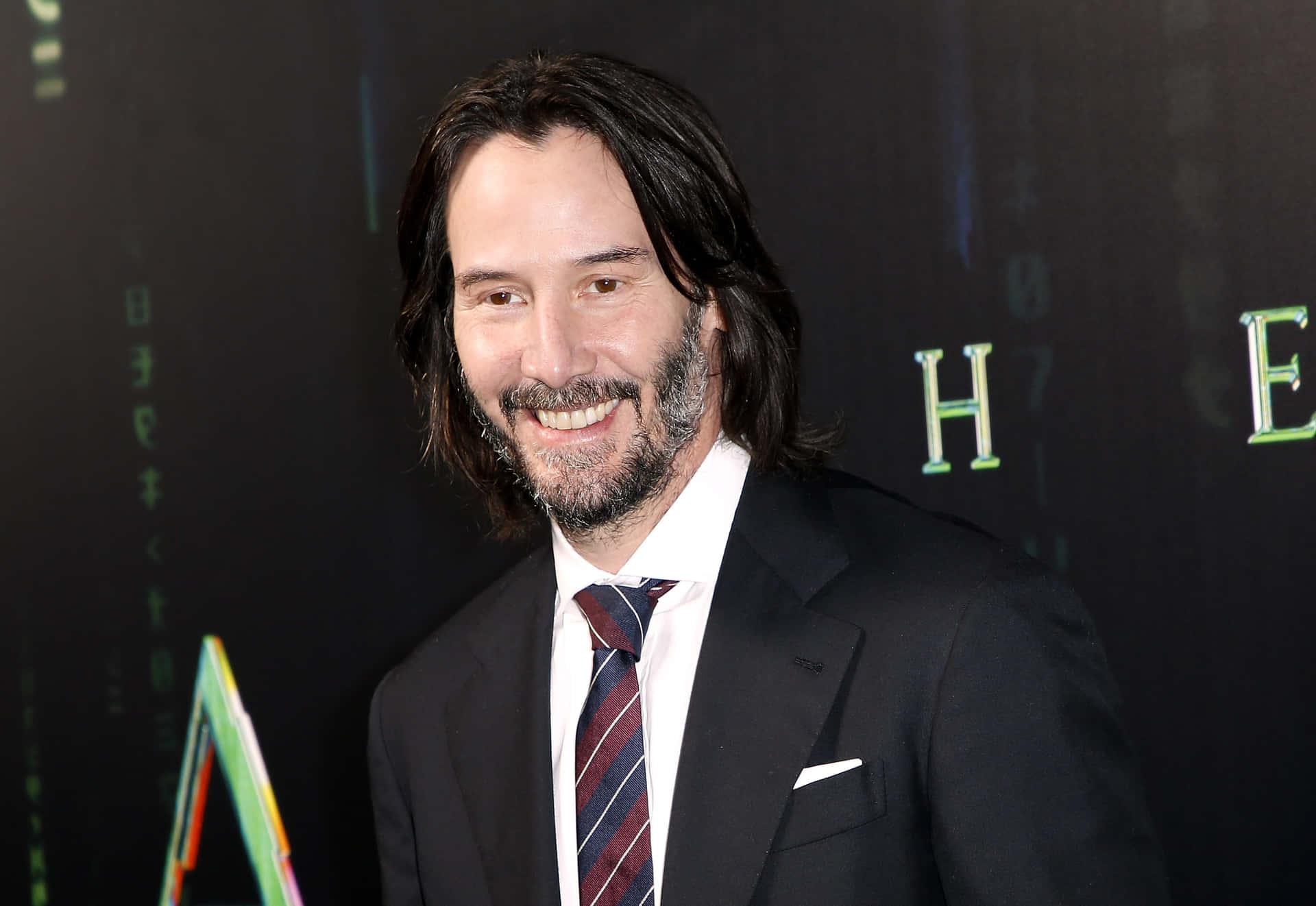 Keanu Reeves looking effortlessly cool in a stylish suit