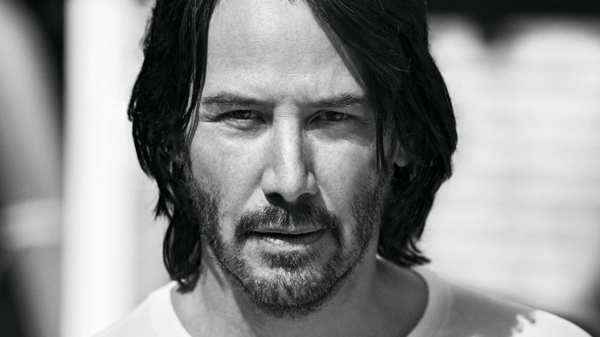 Keanu Reeves standing tall in a dramatic pose
