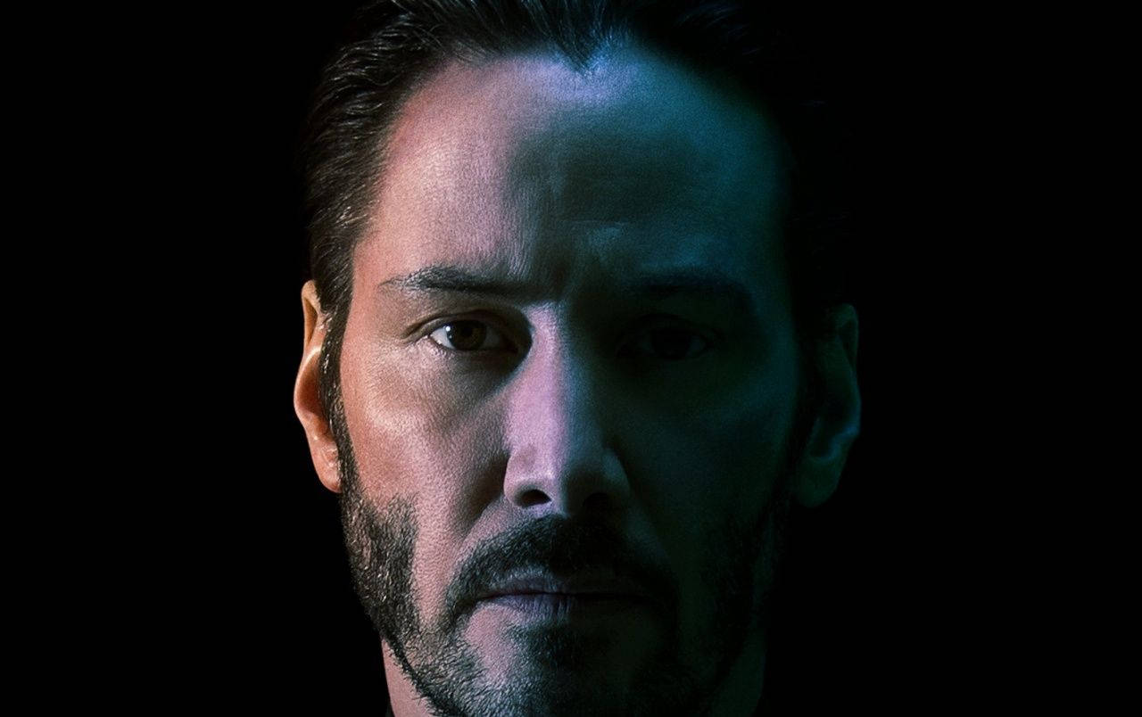 Keanu Reeves Half Face Shot Wallpaper