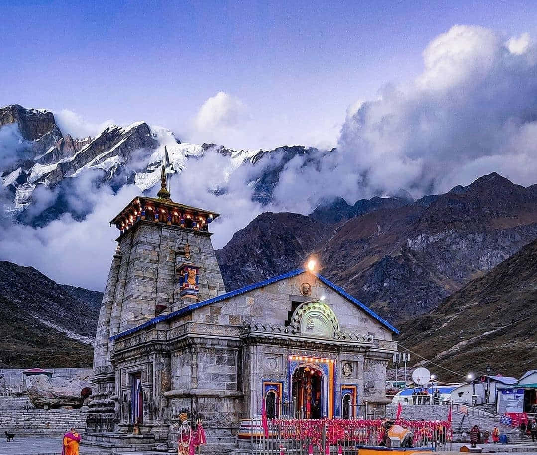 A Temple In The Mountains With Mountains In The Background