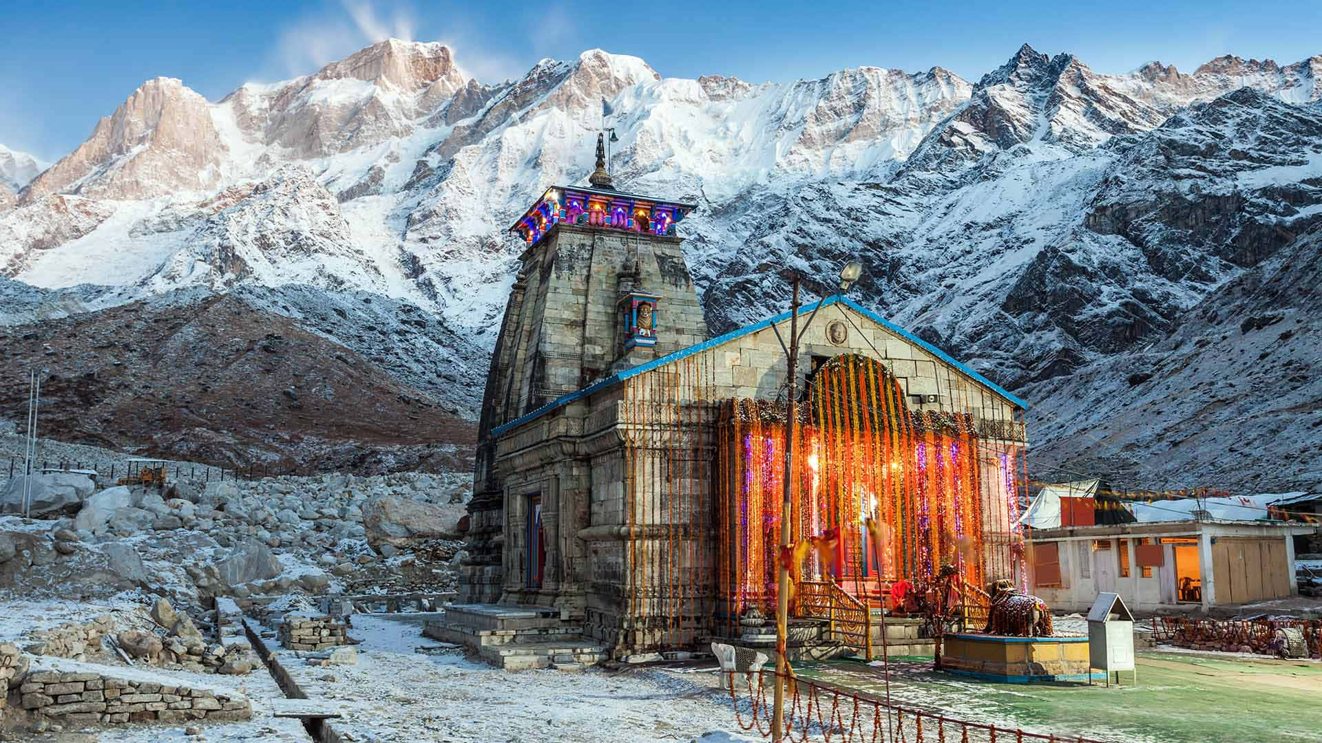 A Temple In The Mountains With Snow Surrounding It
