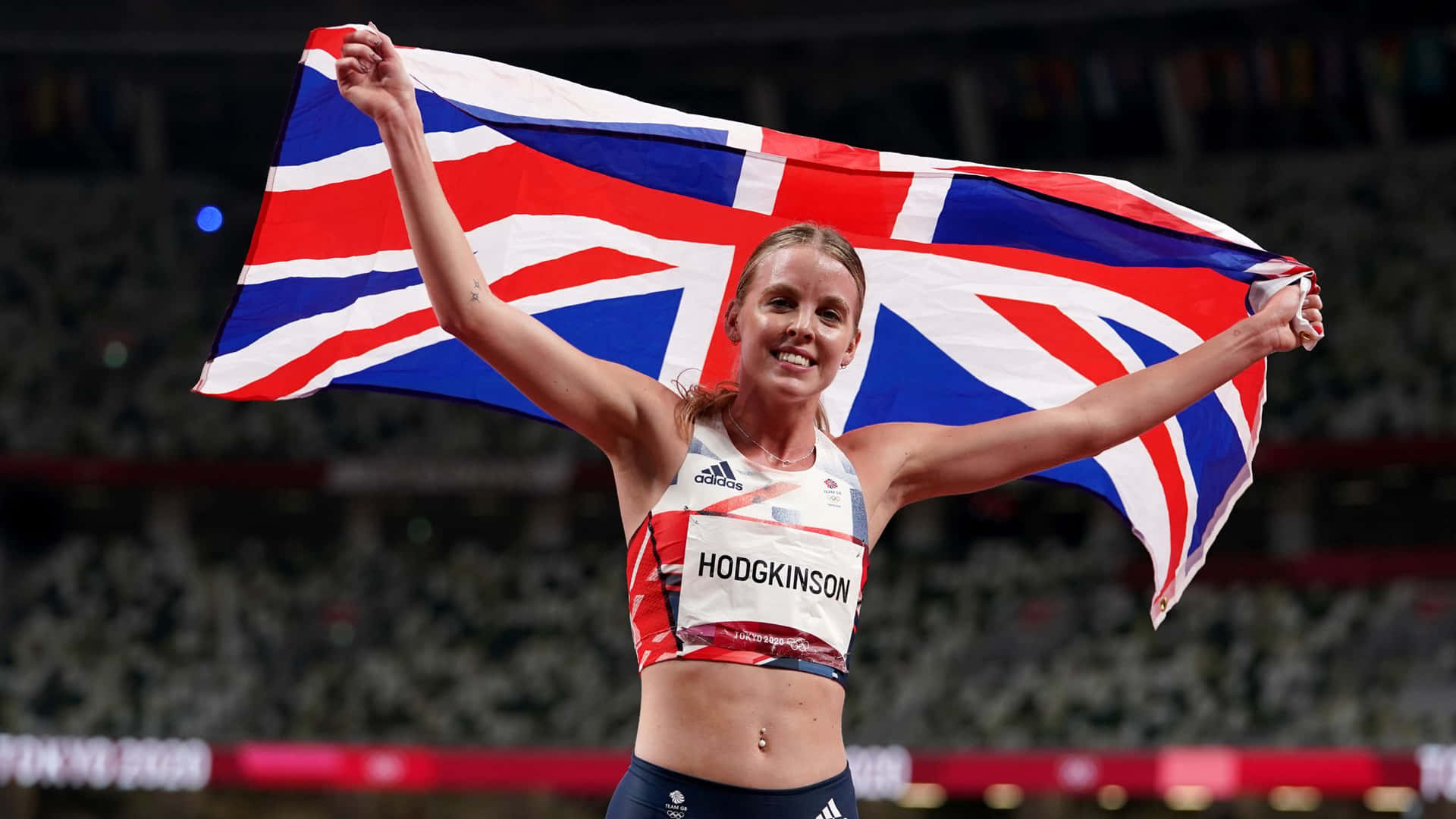 A Woman Holding A British Flag Wallpaper