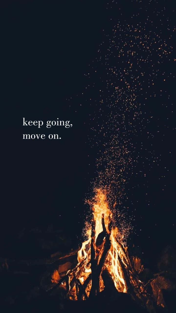 A Fire With The Words Keep Going, Move On Wallpaper