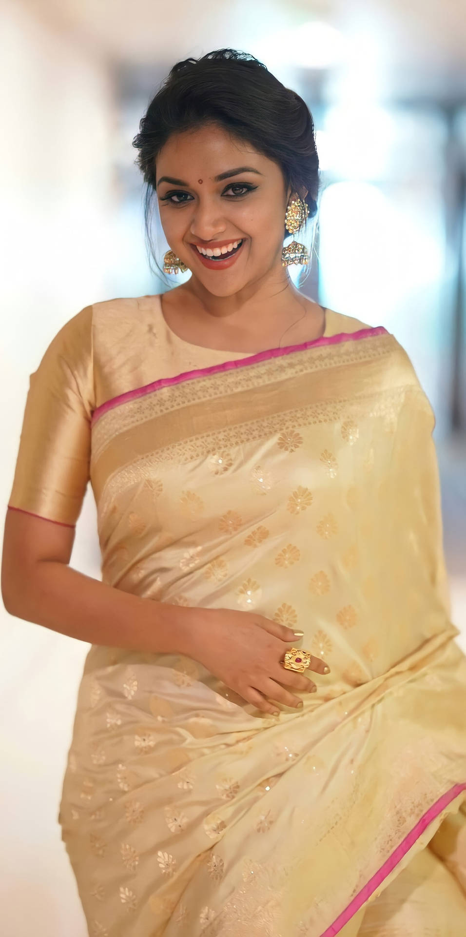 Keerthi Suresh graces in a pale gold sari Wallpaper