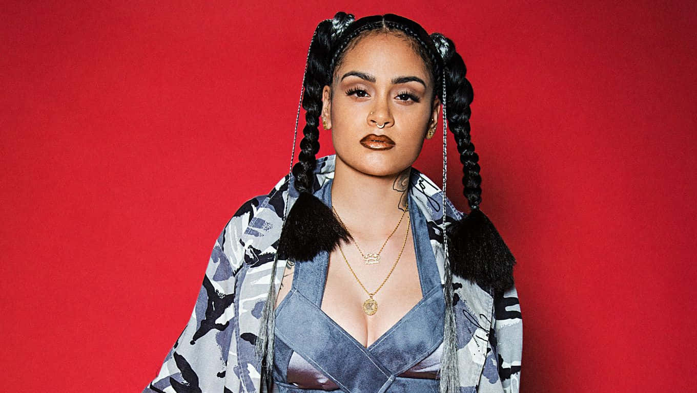 Kehlani stands with confidence at the centre of the stage Wallpaper