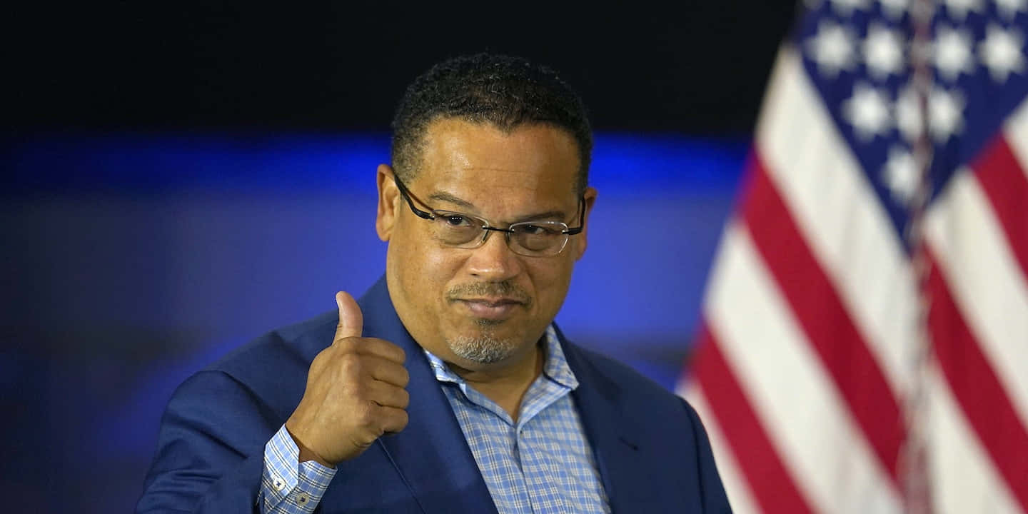 Keith Ellison With Thumbs Up Signal Wallpaper