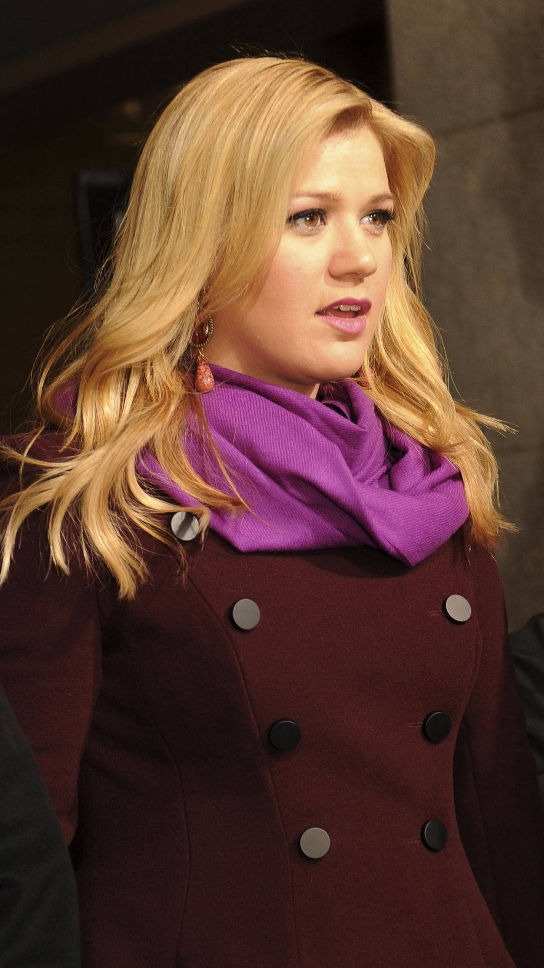 Kelly Clarkson Maroon Coat Background