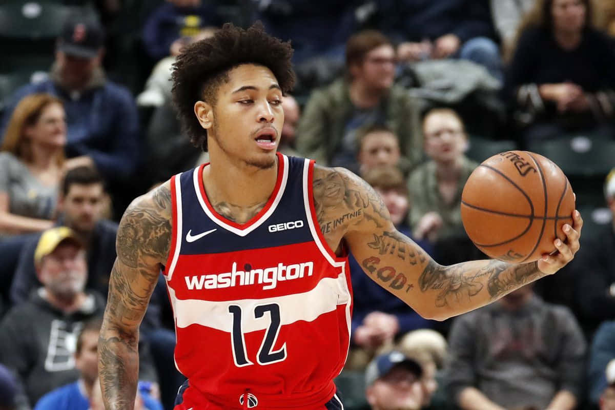 Kelly Oubre Jr. Looking At The Ball Wallpaper