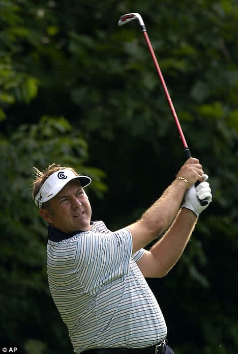 Professional Golfer Ken Duke Swings at PGA Tour Championship Wallpaper
