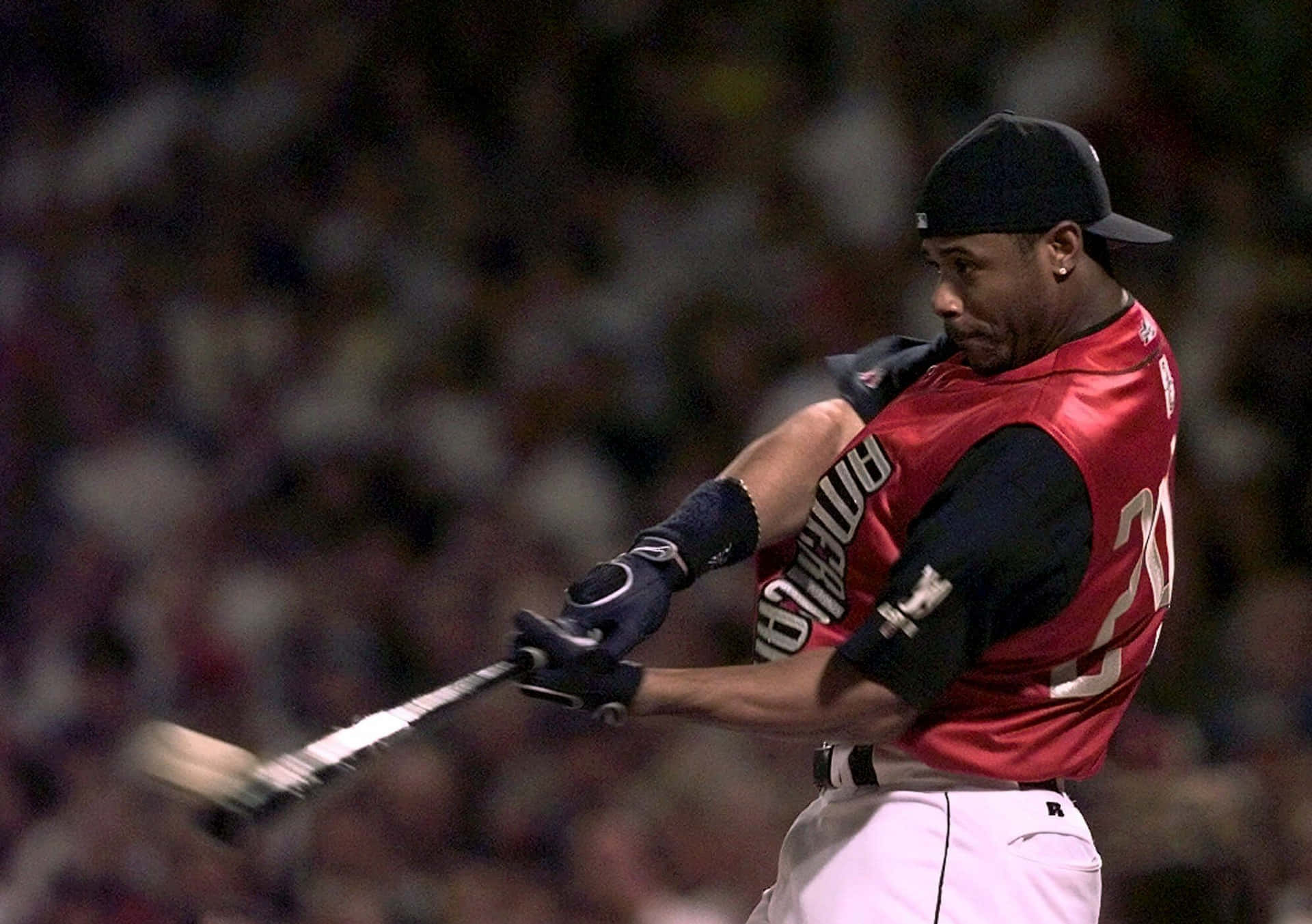 A Baseball Player Swinging A Bat Wallpaper