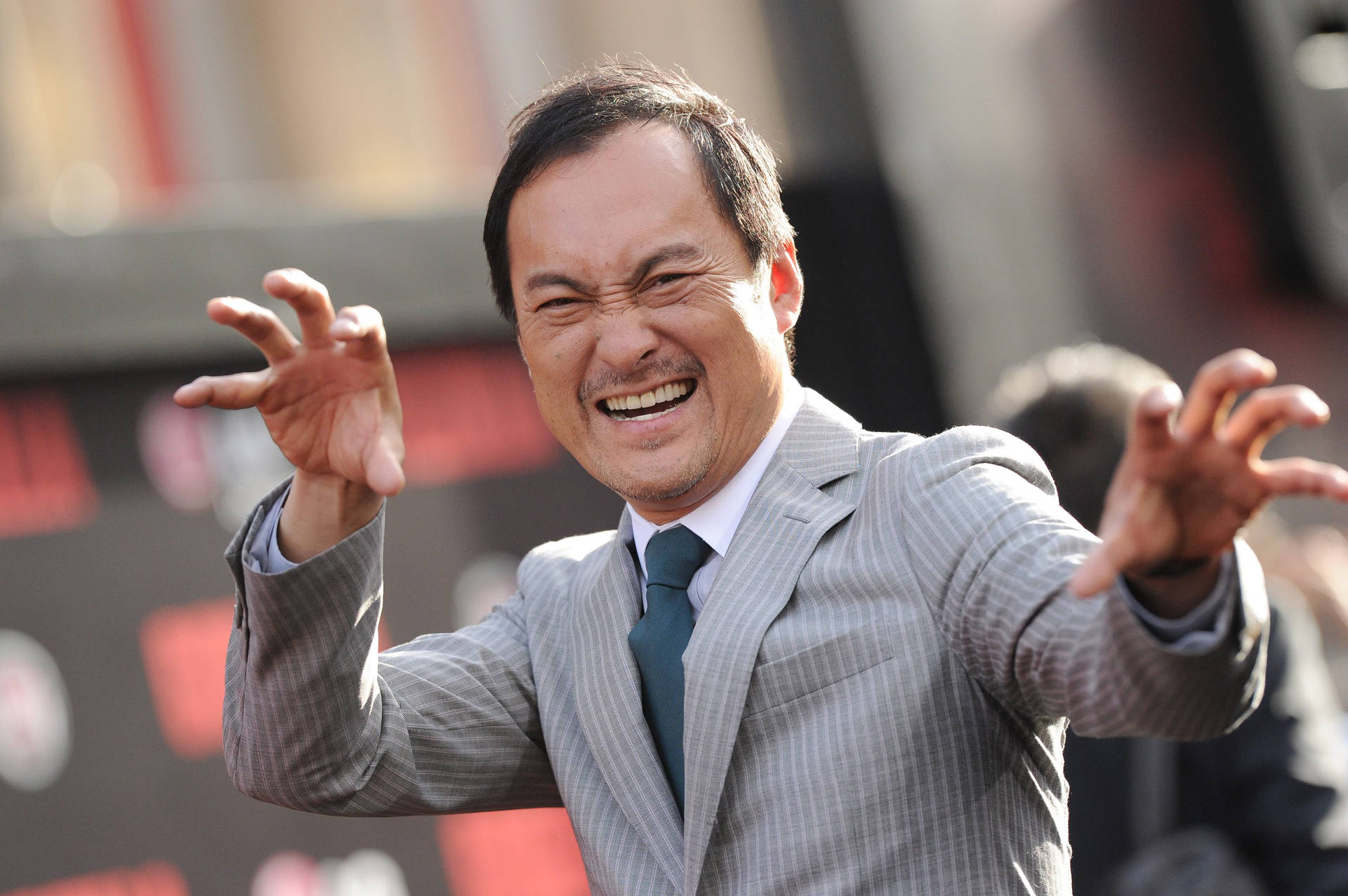 Ken Watanabe Exhibiting a Funny Pose on the Red Carpet Wallpaper