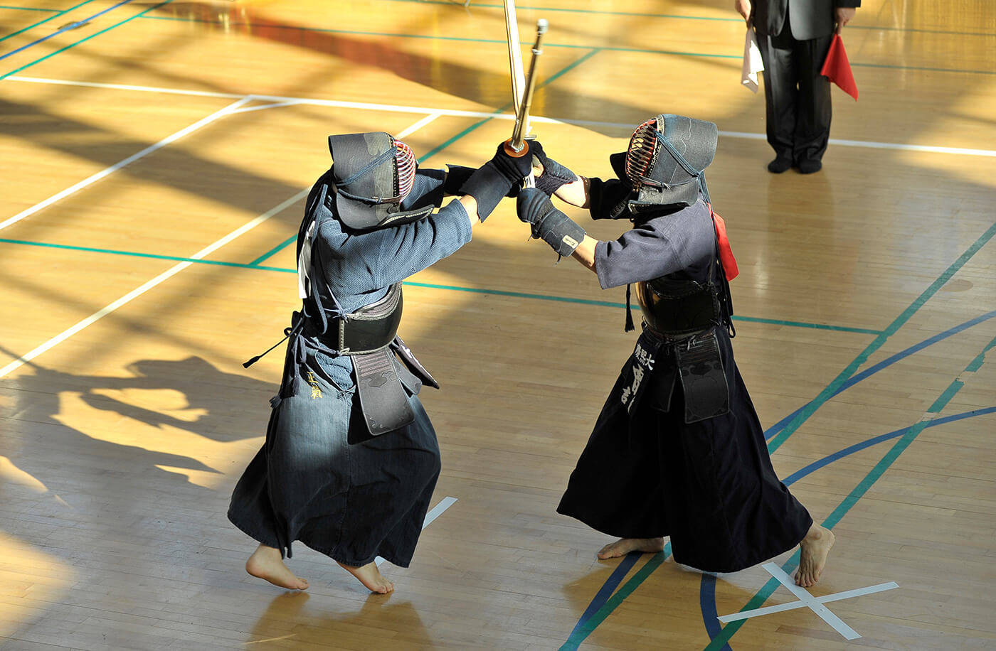 Intense Kendo Battle in Action Wallpaper
