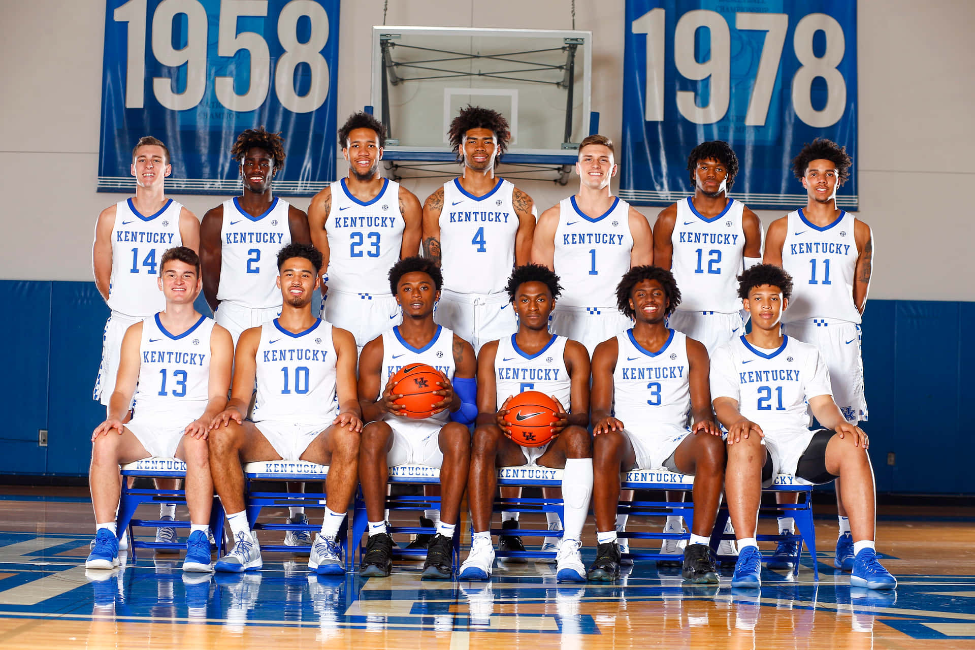 Download The Basketball Team Is Posing For A Photo Wallpaper