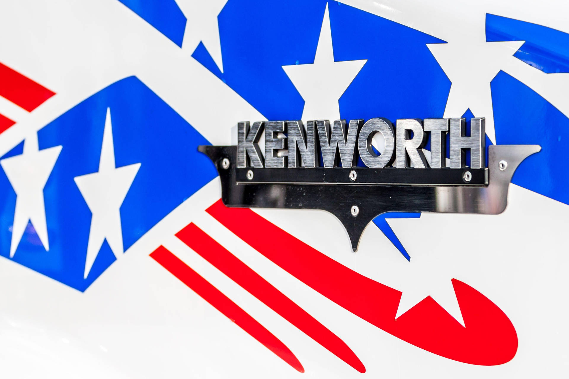 Caption: Kenworth Brushed Metal Logo Wallpaper