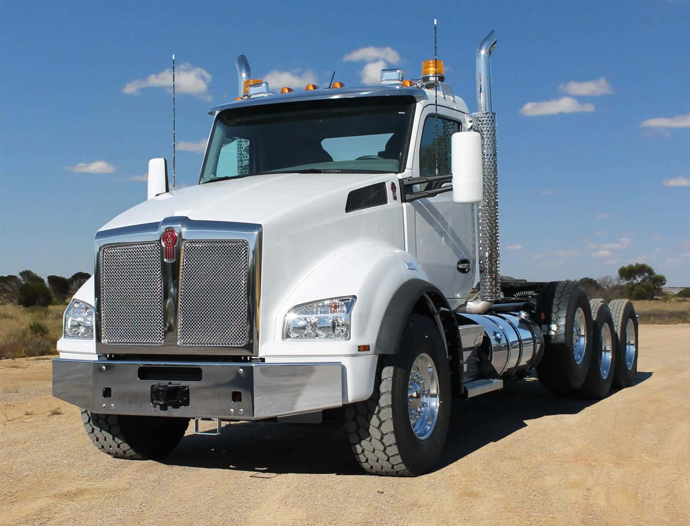 Kenworth T880 Dump Truck Aggressively Dominating The Road Wallpaper