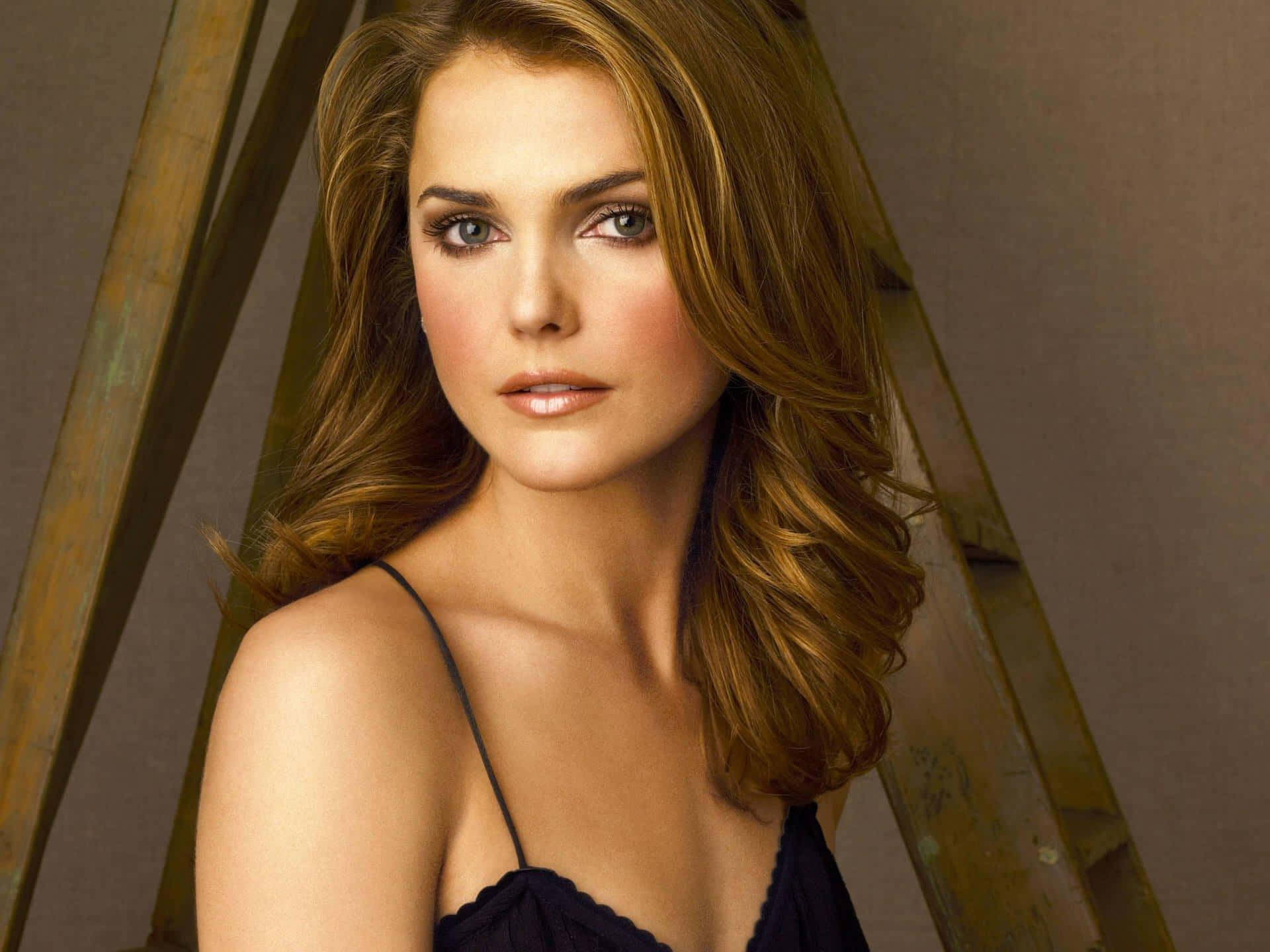 Keri Russell at a photoshoot, radiating elegance and charm Wallpaper