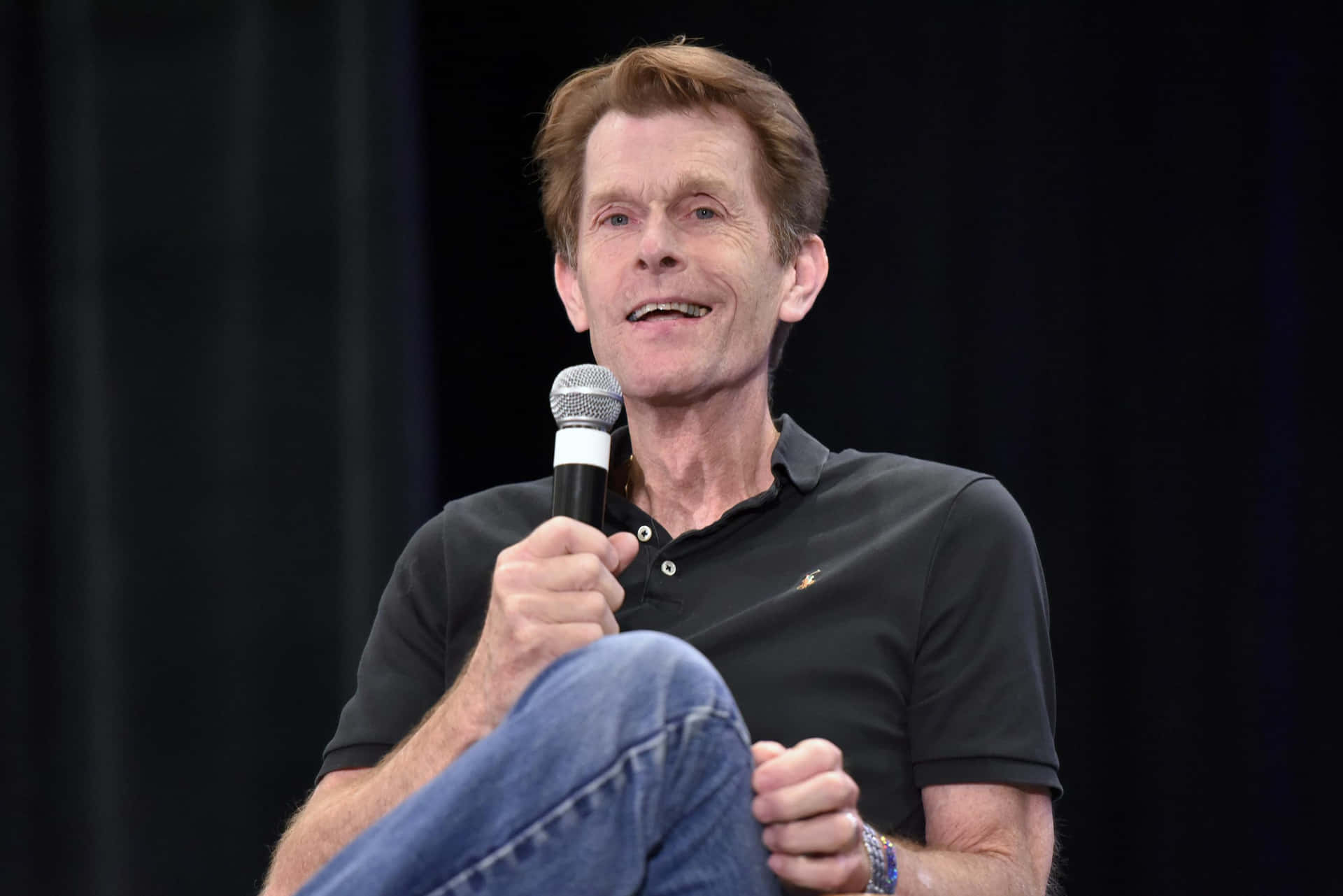 Kevin Conroy at an event, smiling and posing for the camera Wallpaper