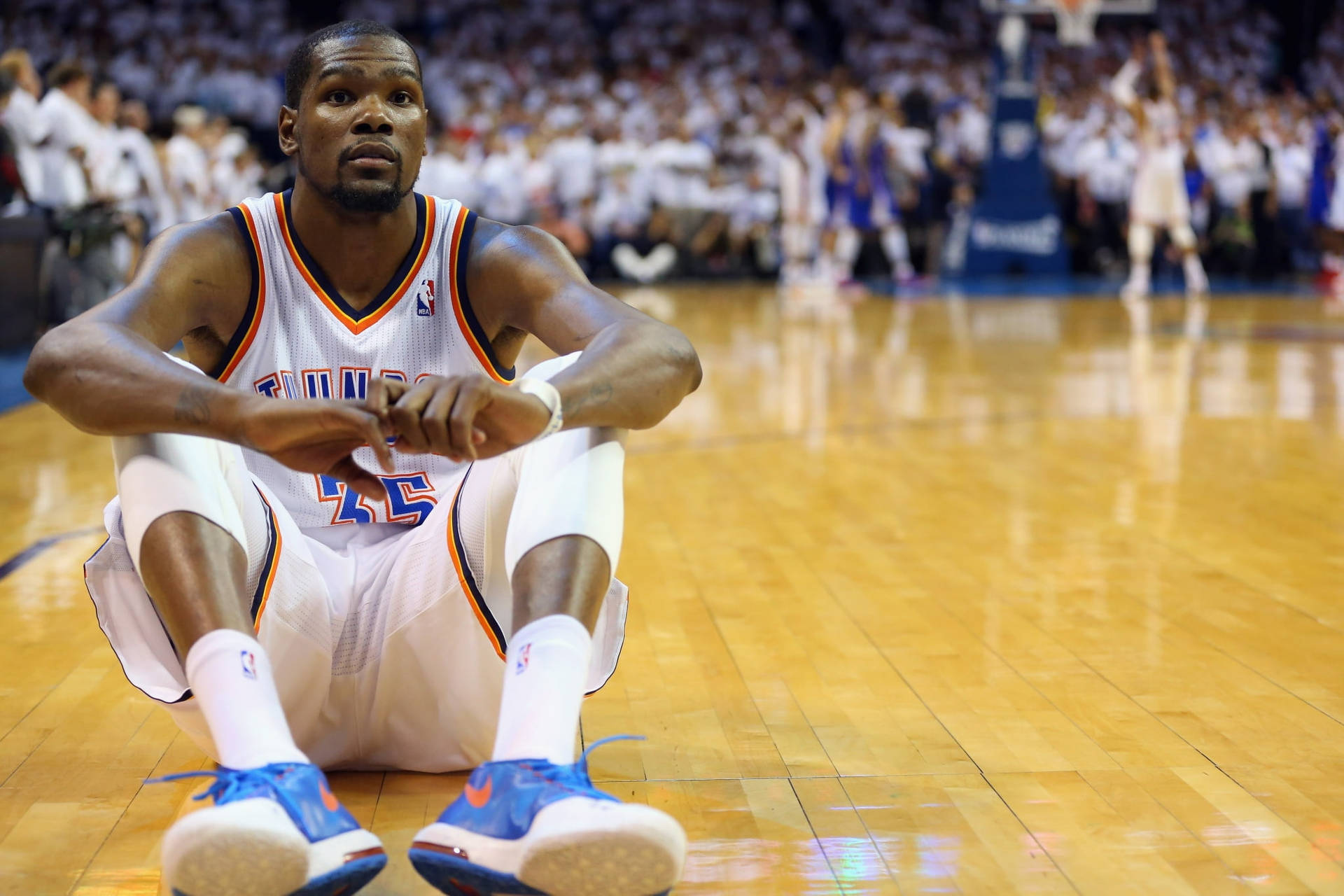 Kevin Durant Sitting On Basketball Court Wallpaper