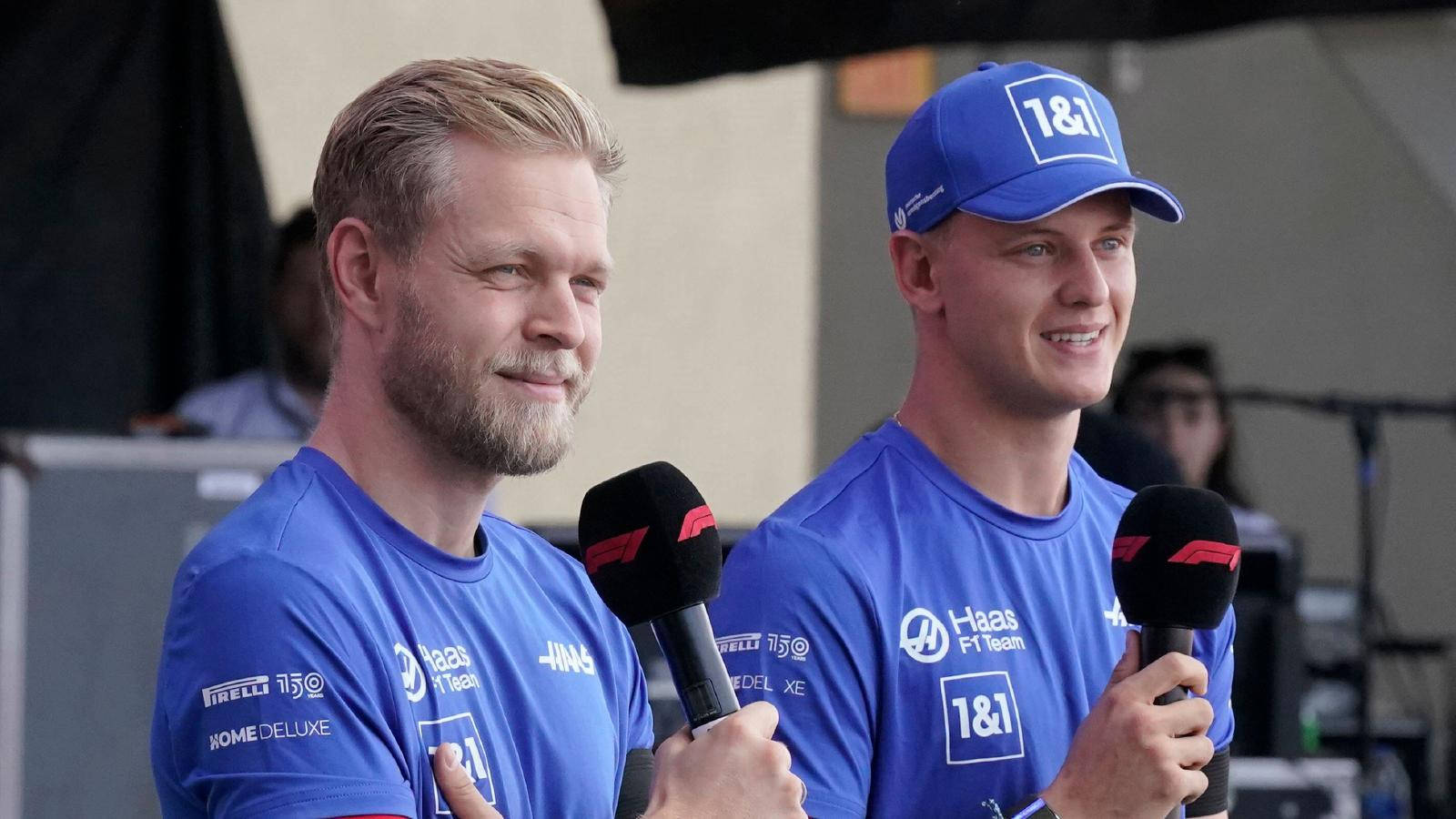 Kevin Magnussen And Schumacher With Microphones Wallpaper