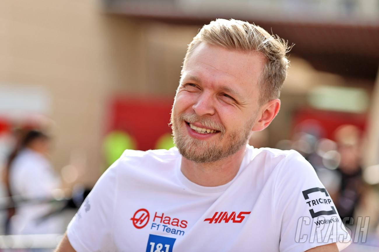 Kevin Magnussen dressed in a white Haas shirt. Wallpaper