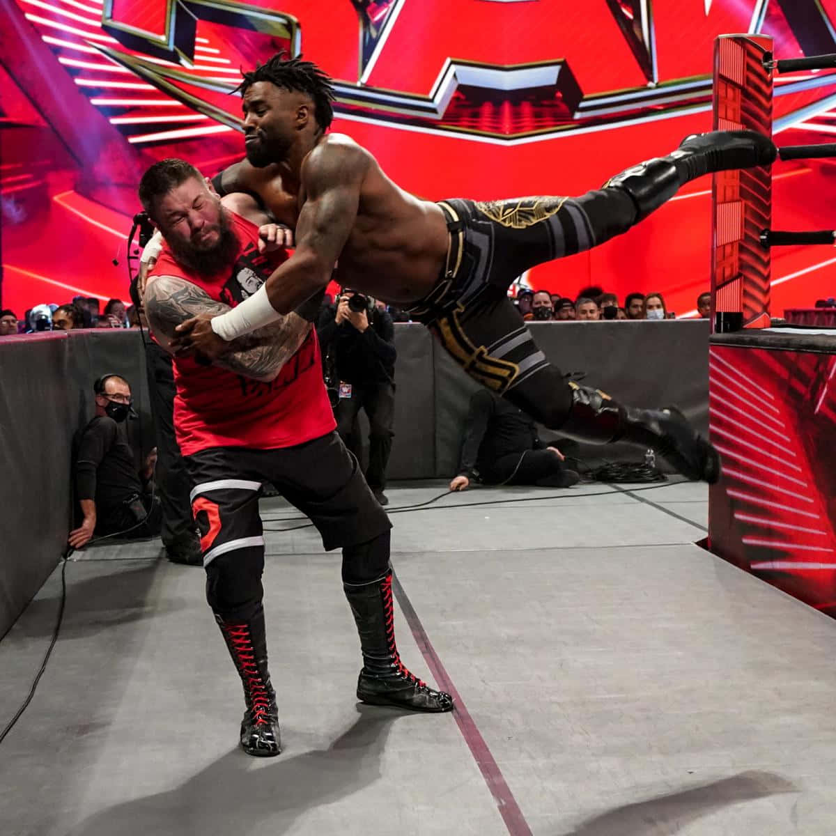 Caption: Intense Showdown between Cedric Alexander and Kevin Owens at WWE Raw Wallpaper