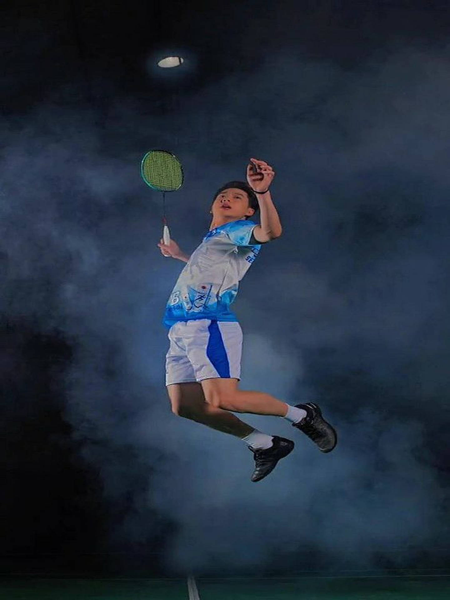 Kevin Sanjaya Showcasing His Impressive Badminton Skills During A Competitive Match Wallpaper