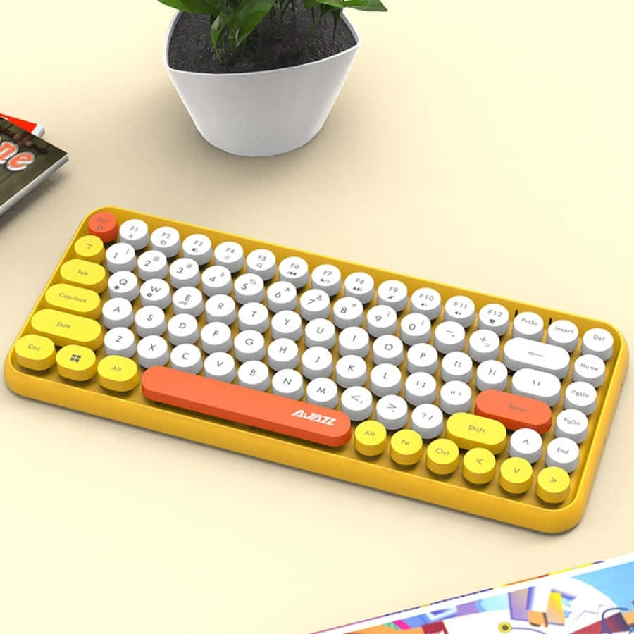 Einegelbe Tastatur Mit Weißen Tasten Und Einer Pflanze Darauf.