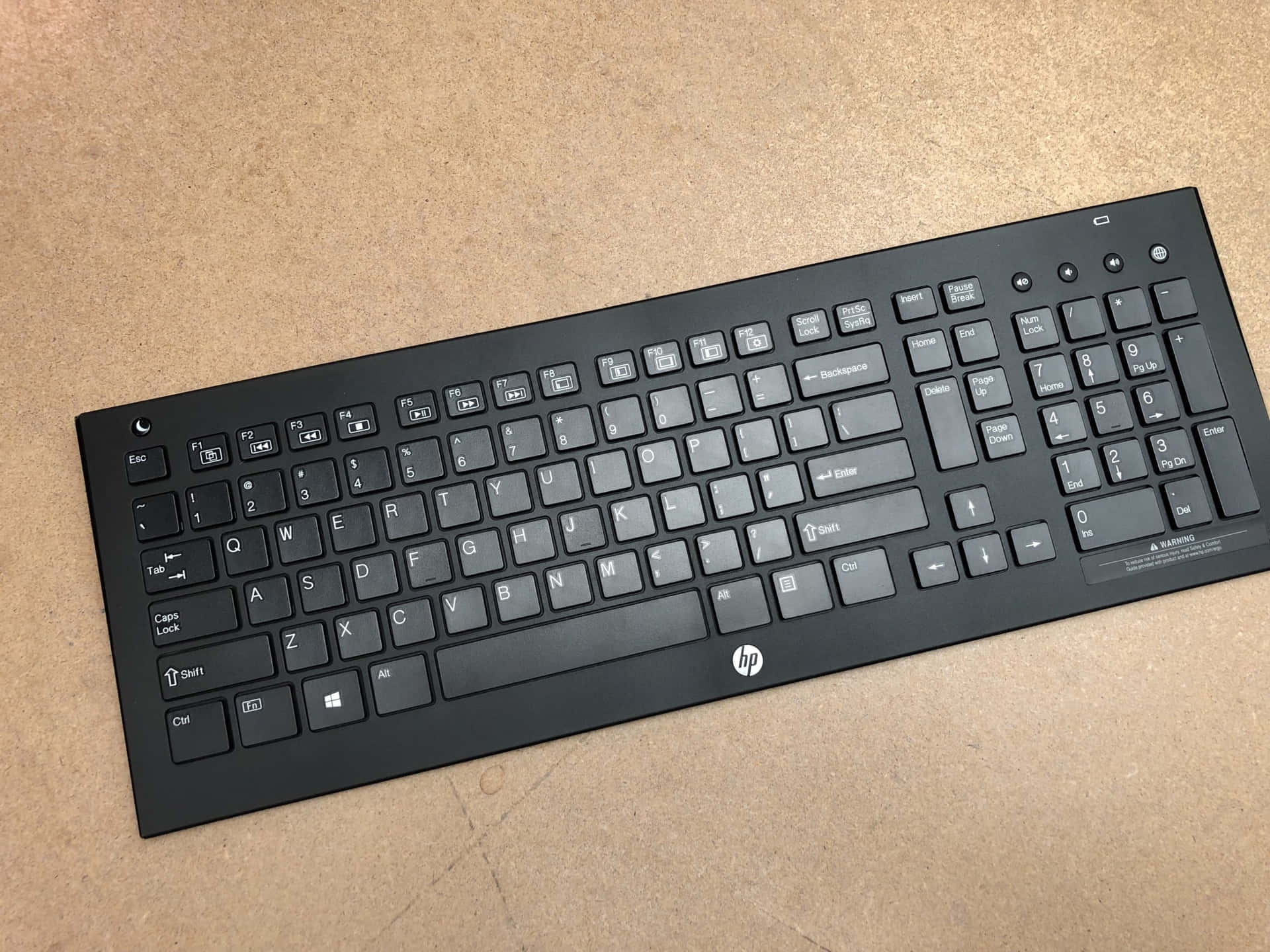 A Black Keyboard On A Table