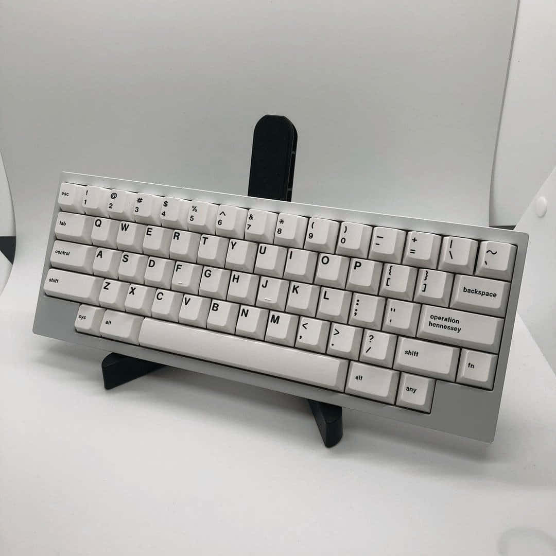 A White Keyboard Sitting On A Stand