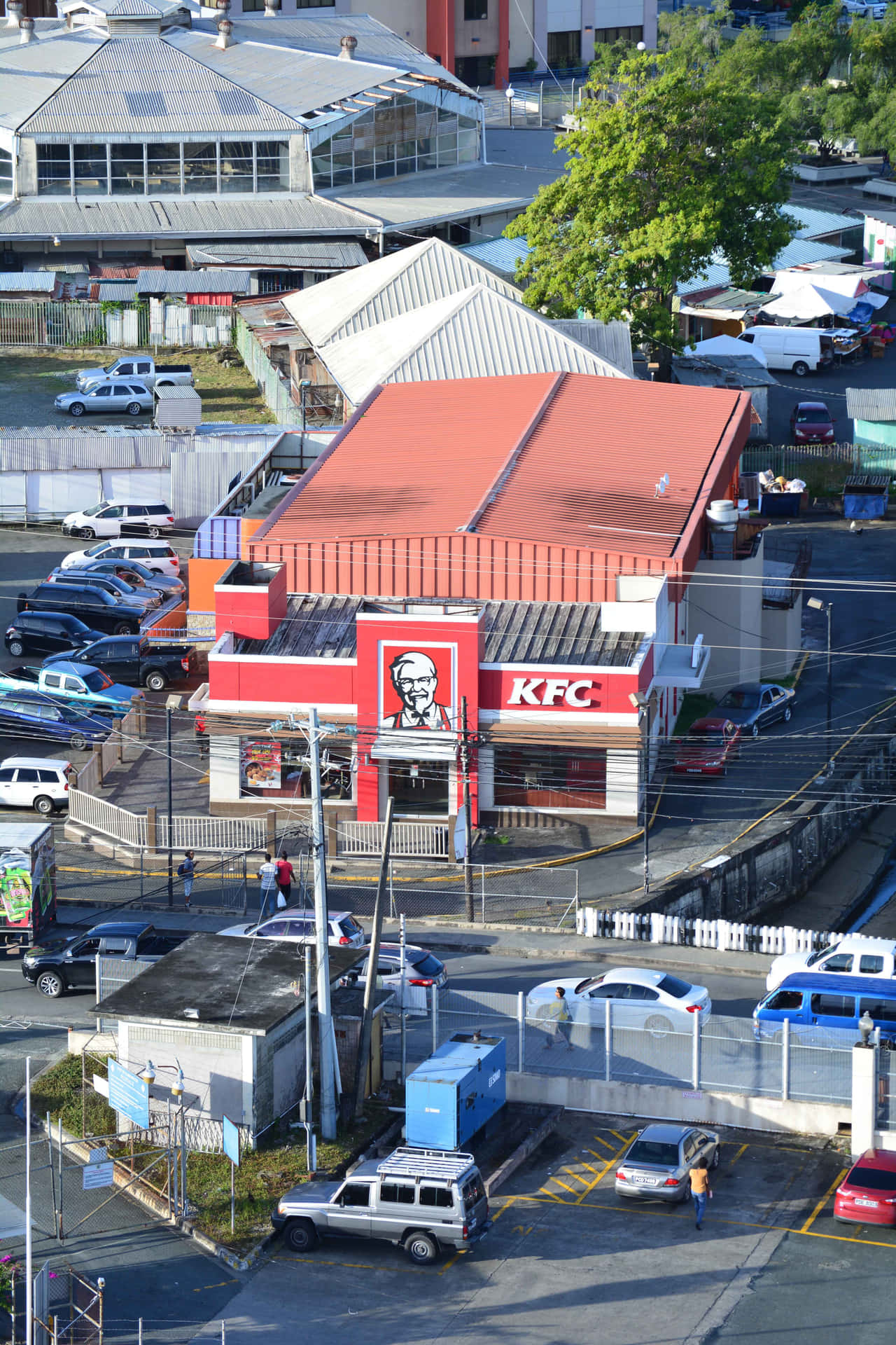 A Kfc Restaurant In The Middle Of A City