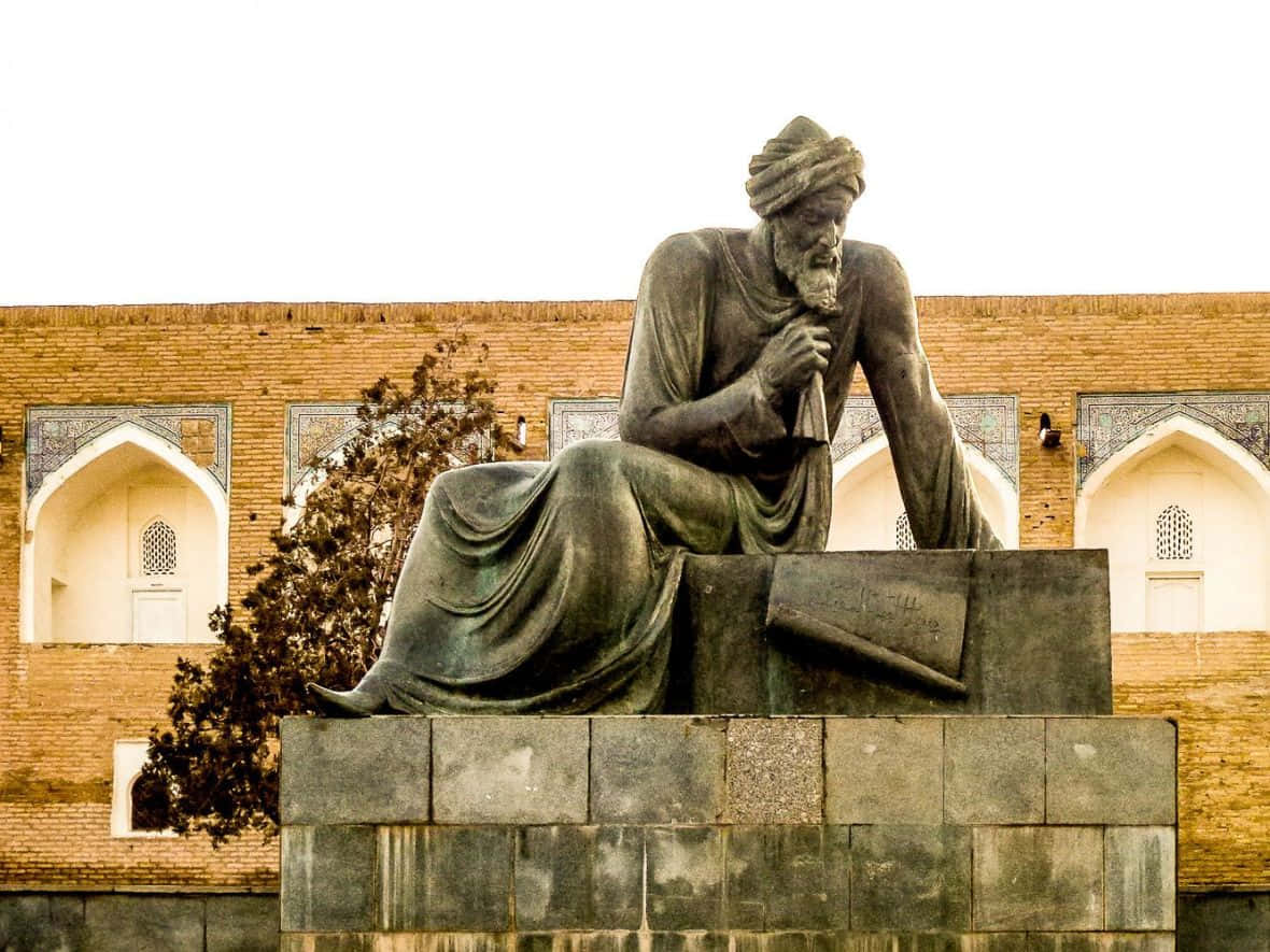 Majestic Statue Overlooking Ancient City of Khiva Wallpaper