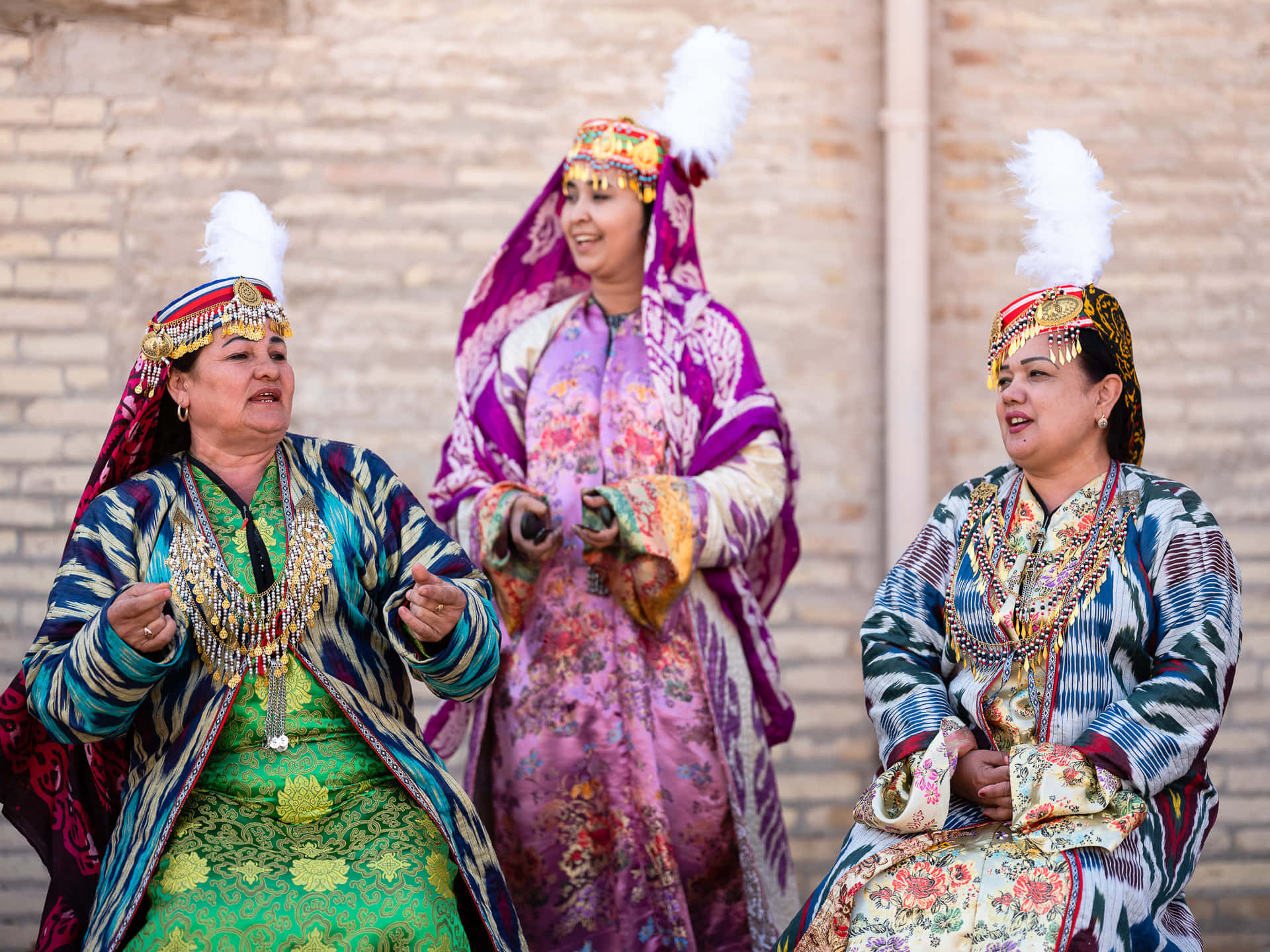 Traditional Khiva Women Displaying Their Cultural Heritage Wallpaper