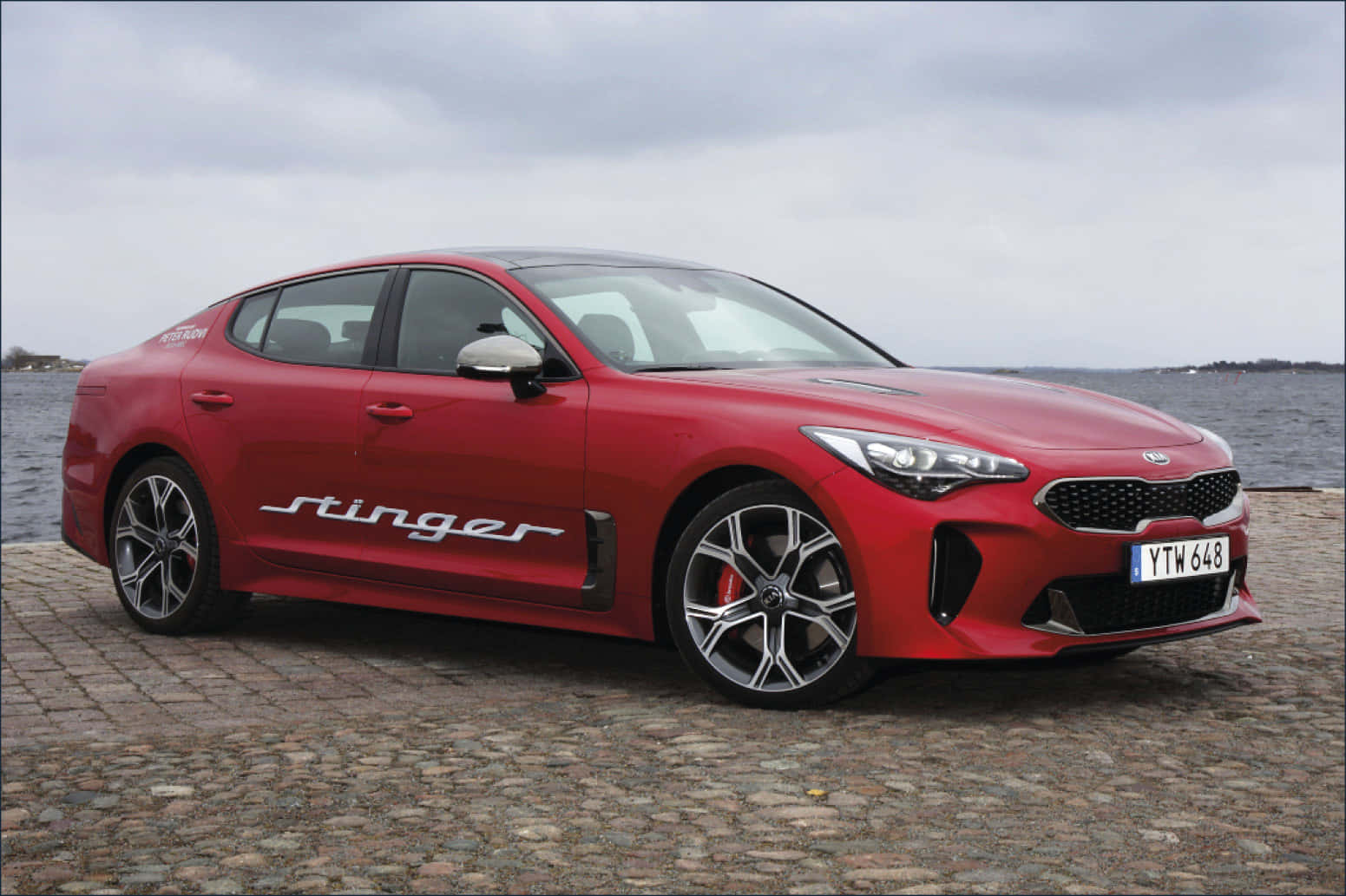 Powerful Kia Stinger Sports Car in Action Wallpaper