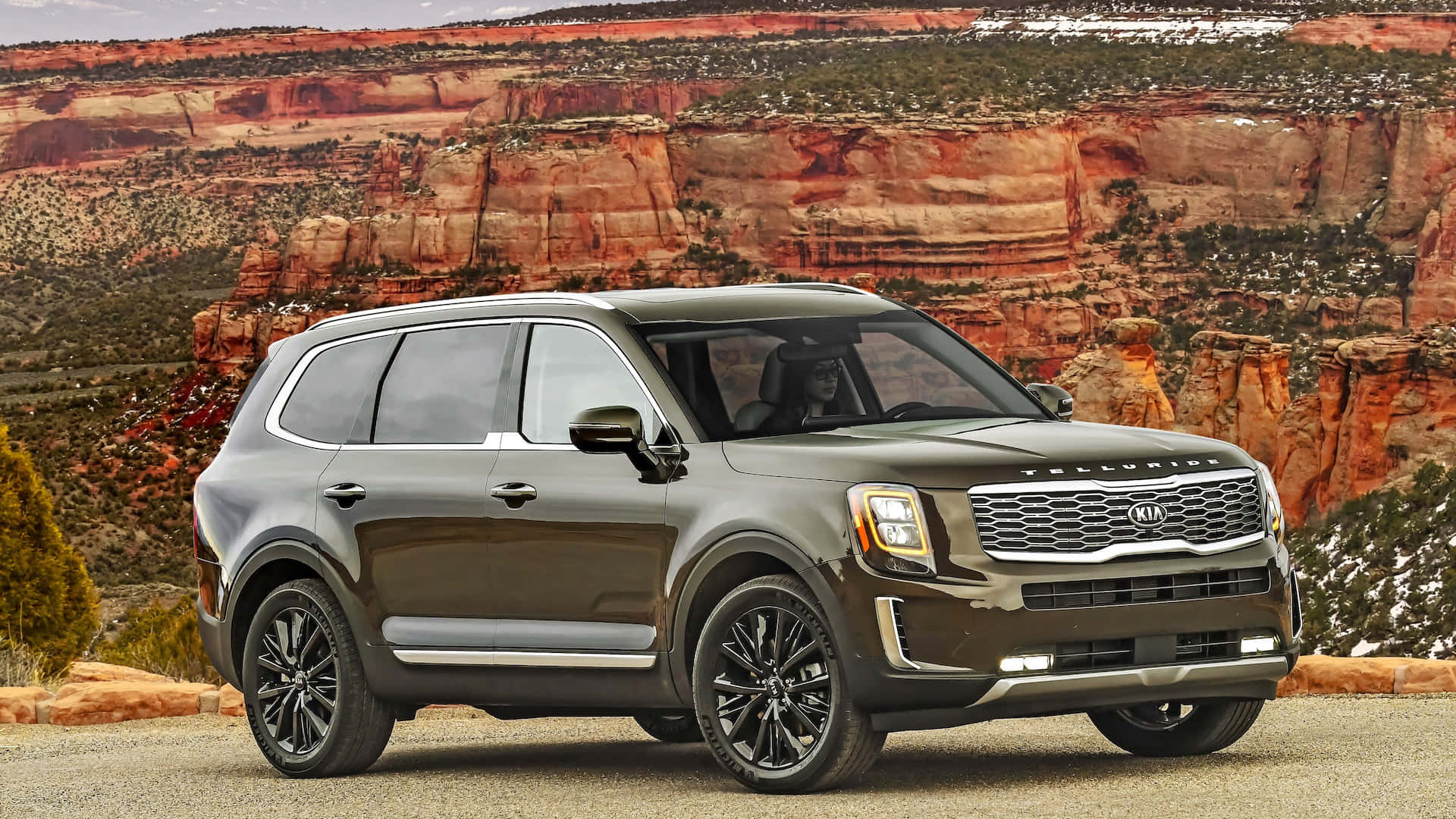 Stunning Kia Telluride on a scenic mountain road Wallpaper