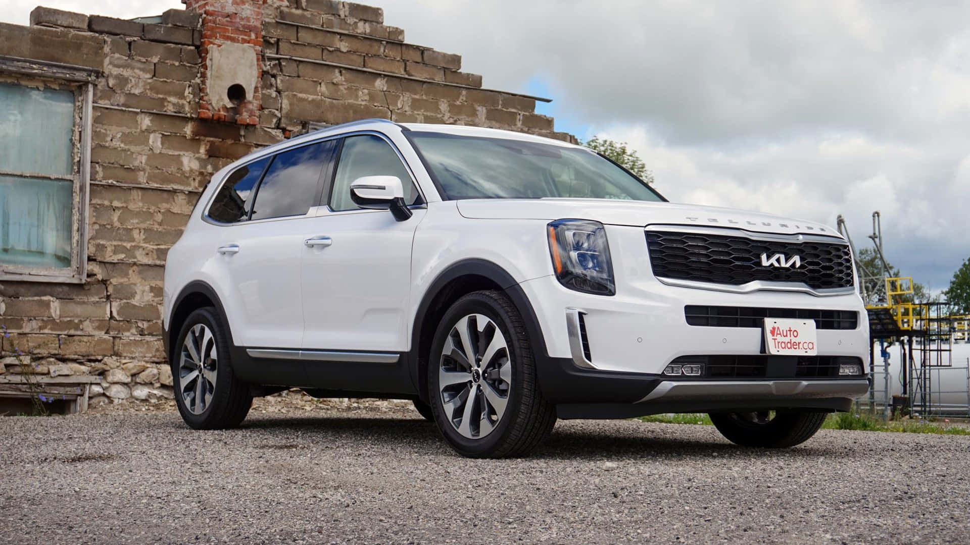 Stunning Kia Telluride dominating the scenic road Wallpaper