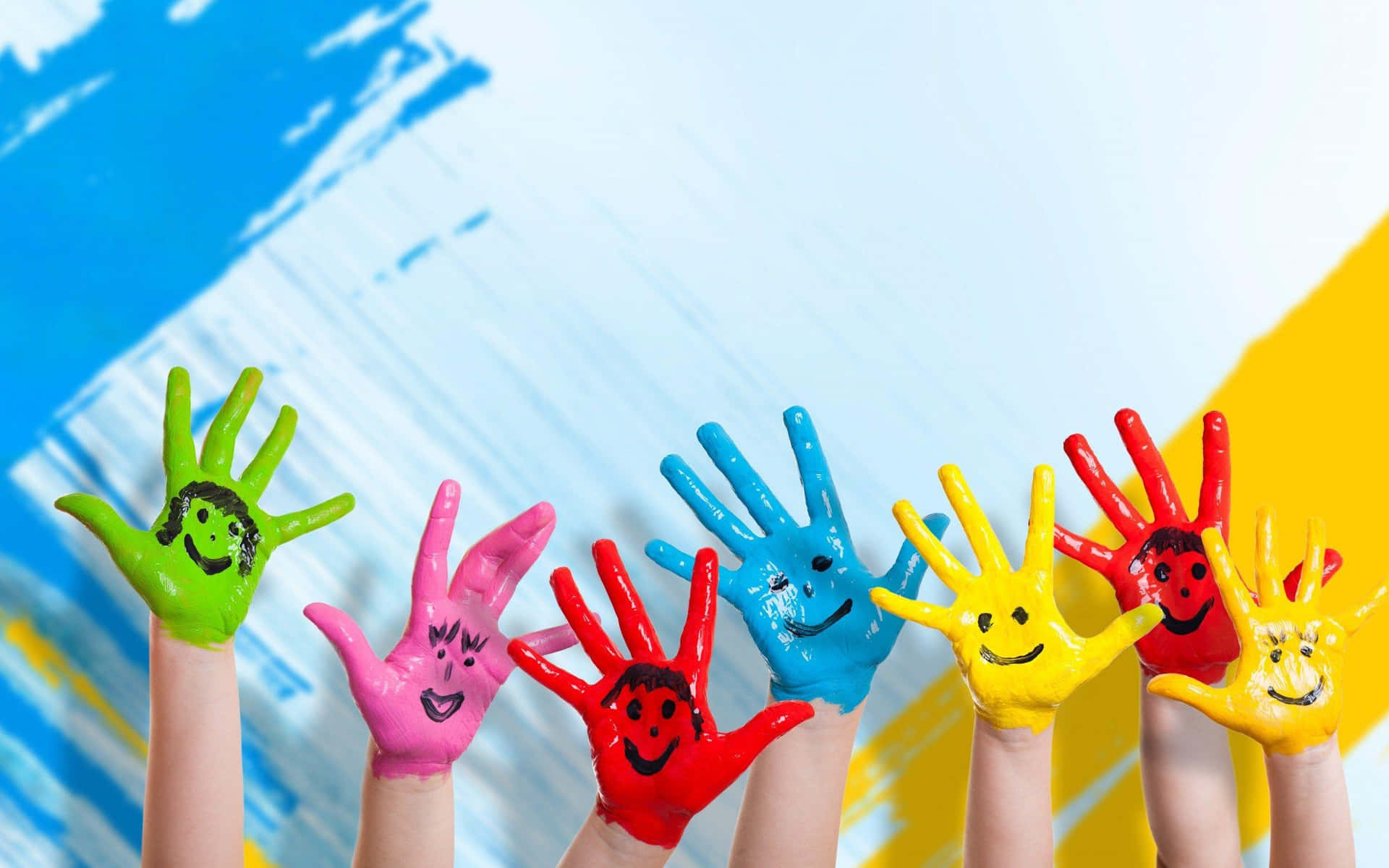 Children's Hands Painted With Smiley Faces