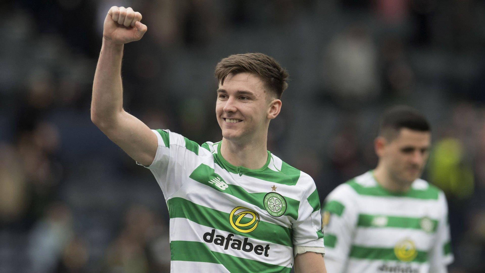 Kieran Tierney Celebrating Victory with Raised Fists Wallpaper