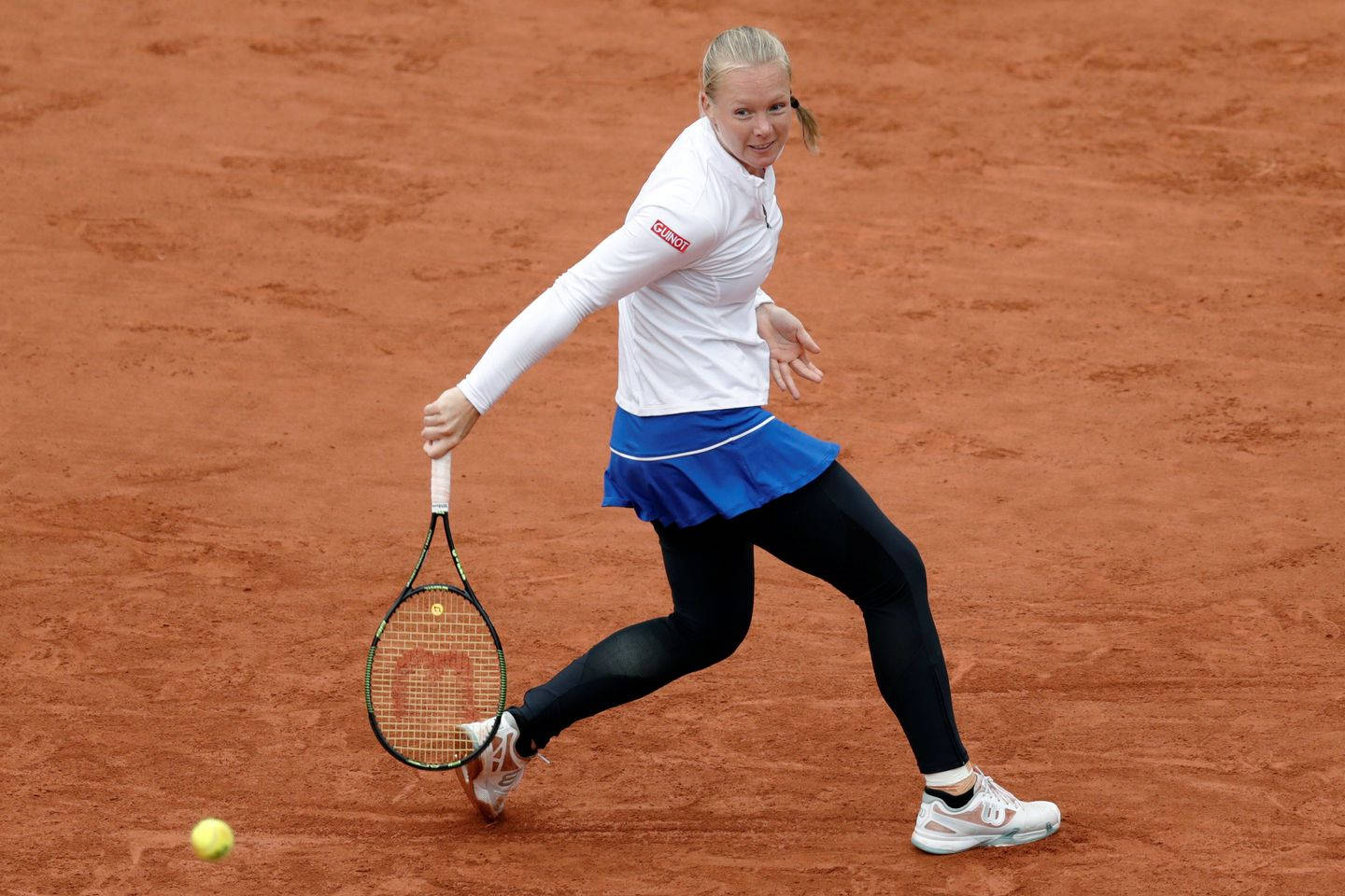 Kiki Bertens demonstrating her power and skill on a clay court Wallpaper
