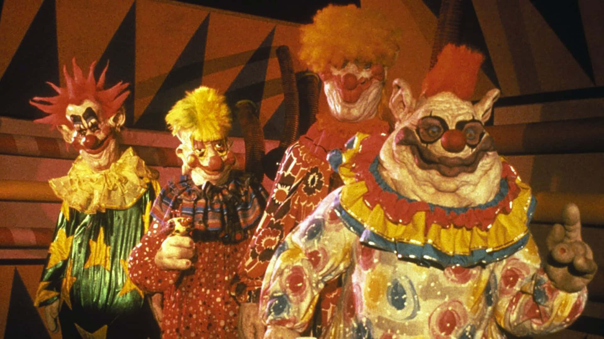 Killer Klowns From Outer Space In Colorful Costumes Wallpaper