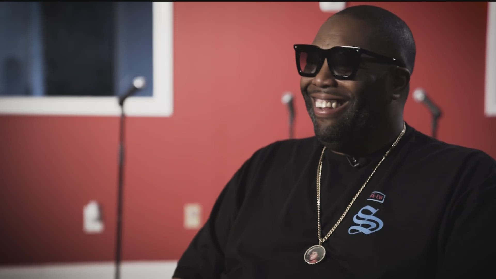 Killer Mike Smiling During Interview Wallpaper